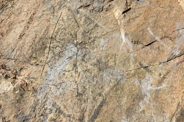 Granite texture. Granite stone close up. Background of natural material. Rocky rocks of ancient times. Natural pattern