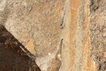 Granite texture. Granite stone close up. Background of natural material. Rocky rocks of ancient times. Natural pattern