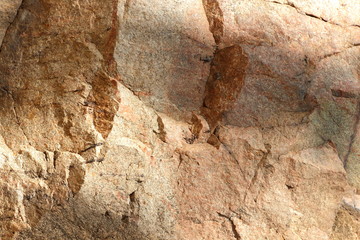 Granite texture. Granite stone close up. Background of natural material. Rocky rocks of ancient times. Natural pattern