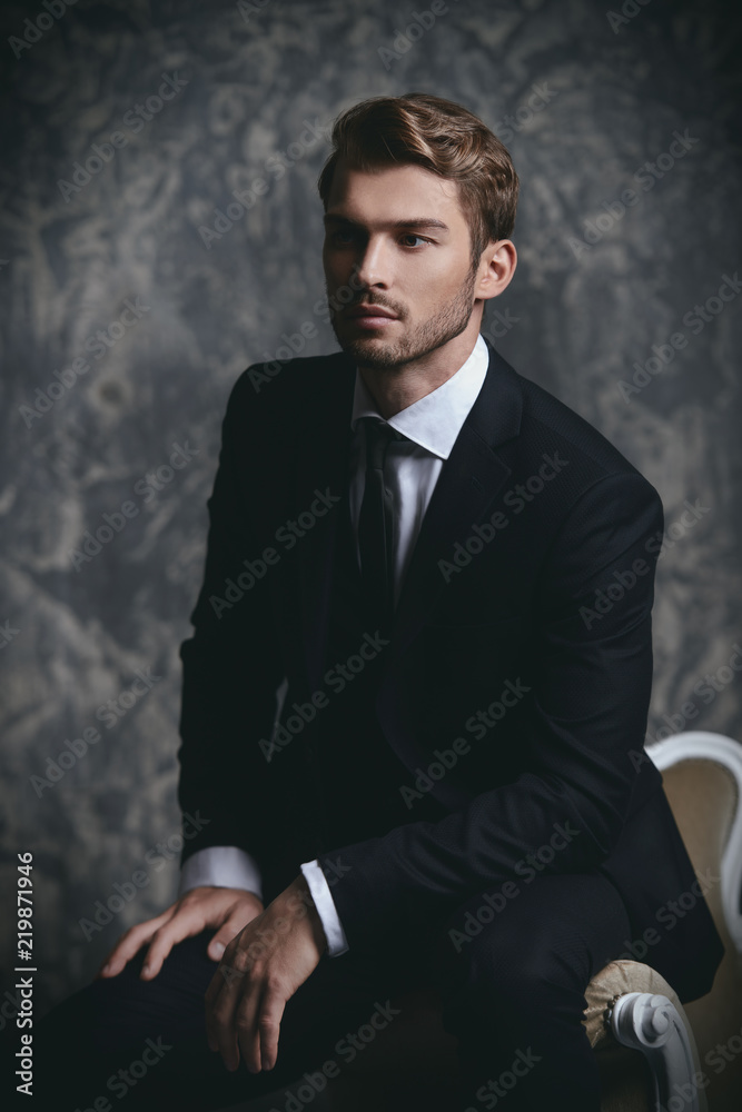 Wall mural handsome boy in suit