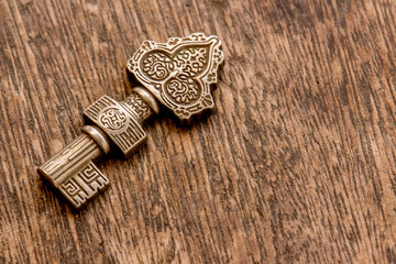 decorated key  over a rustic background