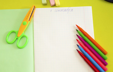Table student, on the desk notebook, pen, and other school supplies
