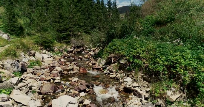 Drone flight in summer over mountain stream in the Nockberge mountains in the Thunder Gorge in Carinthia in innerkrems, lungau, schoenfeld