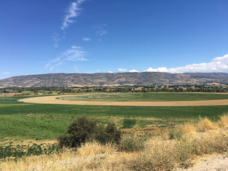 farmland in the utah mountain ranges in midway utah