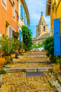 View of a narrow street in the historical center of Arles, France