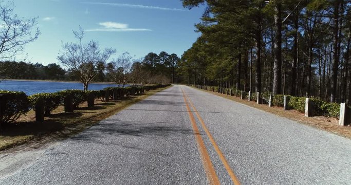 Rural roadway by lake, aerial