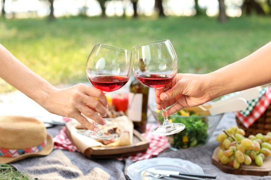 Happy Couple Drinking Wine In Park, Closeup. Summer Picnic