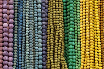 Colorful Beads Background. Background pattern of multicolored natural stone beads. String of beads in various colors. Colorful beads necklaces. Handicraft fashionable for women