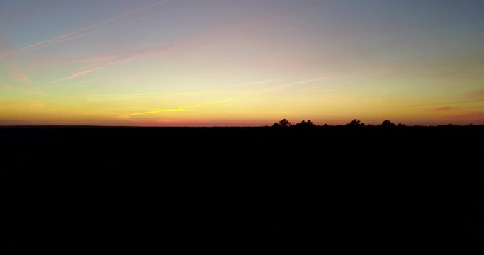 Aerial, sunset over bushes