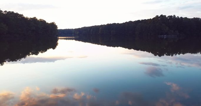 Aerial, reflective lake at sunset