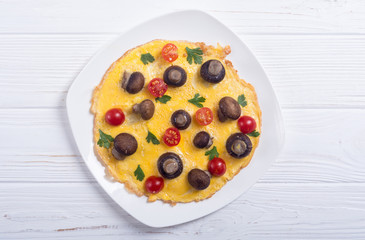 Omelette with mushroom , tomato and parsley