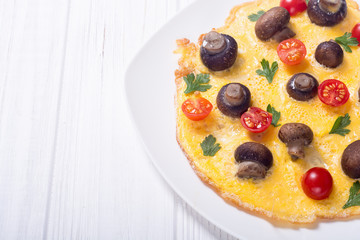 Omelette with mushroom , tomato and parsley