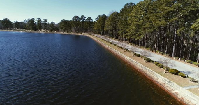 Aerial, road on lake shore