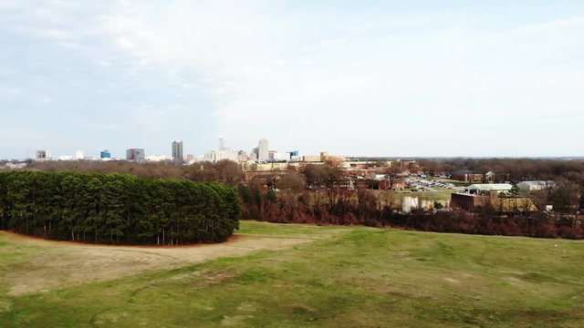 Panning aerial, field outside Raleigh
