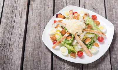 Salad ceasar with chicken , eggs and tomatoes