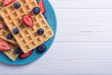 Belgian waffles with strawberry and blueberry