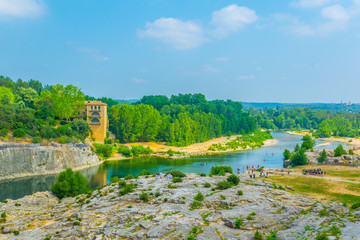 River Gardon flowing under Pont du Gard aqueduct in France