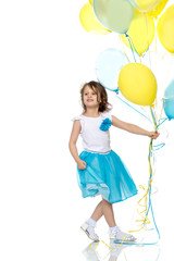 Little girl with multicolored balloons.