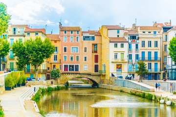 Canal de la robine flowing through the city center of Narbonne, France