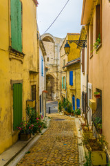 View of a narrow street in the historical center of Arles, France