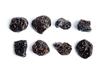 Top view of prunes at white isolated background