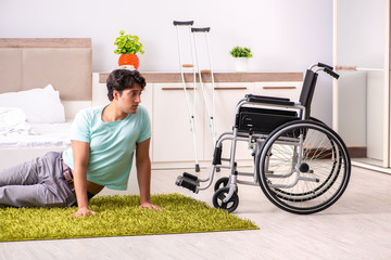 Young handsome disabled man recovering at home 