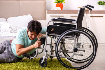Young handsome disabled man recovering at home 