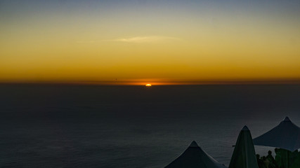 A beautiful orange sunset at the top of Table Mountain, Cape Town, South Africa