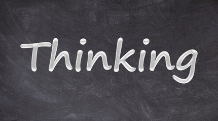 Obraz premium Thinking written on blackboard