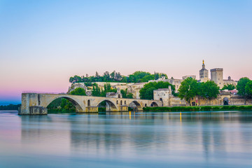 Sunset view of cityscape of Avignon with Palais des Papes, Cathedral of Our Lady and Pont Saint...
