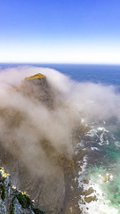 Hills cliff with clouds and blue ocean at the cape of good hope, Cape Peninsula, South Africa