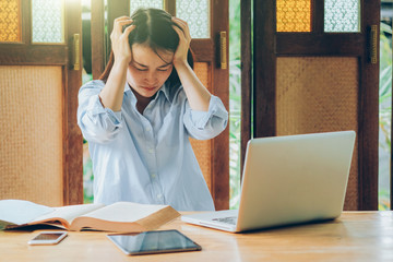 Beutiful asian business woman working with laptop, mobile phone, and tablet in vintage tone, stock...