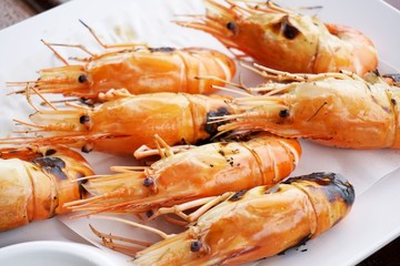  close up shrimp grilled on white plate