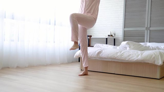 girl raises her legs and her arms with music