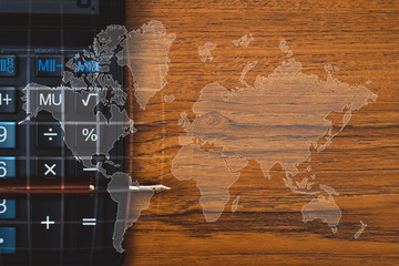 Double exposure of Fountain pen or ink pen with calculator on table with world map, office desk concept. element by NASA.