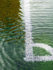 Flooding in artificial grass football field