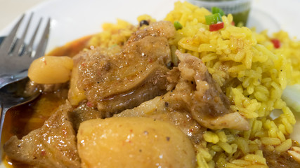 Meat curry Muslim yellow rice with beef (Khao Mok) , traditional halal famous food of islamic people in Thailand