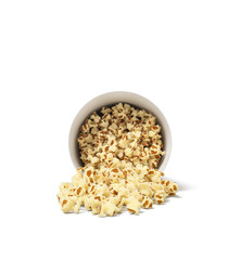 3d rendering of a round striped popcorn bucket lying on its side with popcorn spilling out of it.