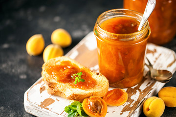 Jam in a jar and fresh fruits