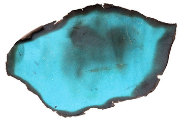A small piece of a glossy magazine  blue color  page burnt in the fire concept.