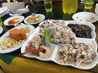 Ceviche. Traditional peruvian cuisine with seafood, corn and sweet potatoes