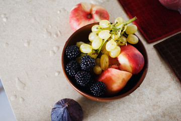 full fruit breakfast bowl Grapes peach blackberry figs Healthy food