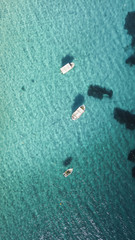 Beautiful tropical beach with boats. Cristal clear water in Formentera.Aerial view.