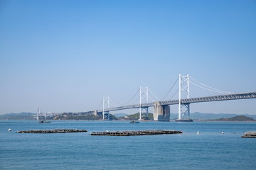 Seto Ohashi Bridge and Aquaculture rafts in seto inland sea,shikoku,japan