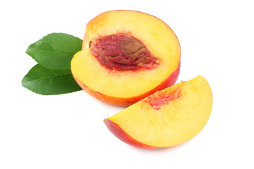Nectarine with green leaf and slices isolated on white background.