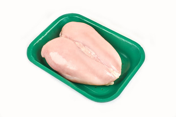 Raw chicken breast in a tray on a white background.