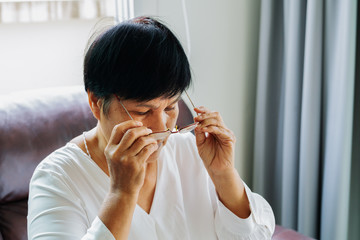 portrait of old woman wearing her glasses