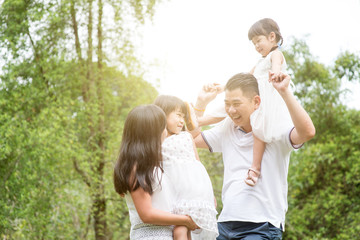 Portrait of Asian family at outdoor.