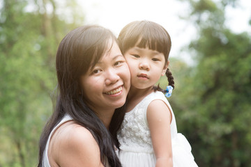 Asian mother and daughter outdoor portraits.
