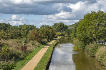 Trent and Mersey canal with towpath in Cheshire England UK